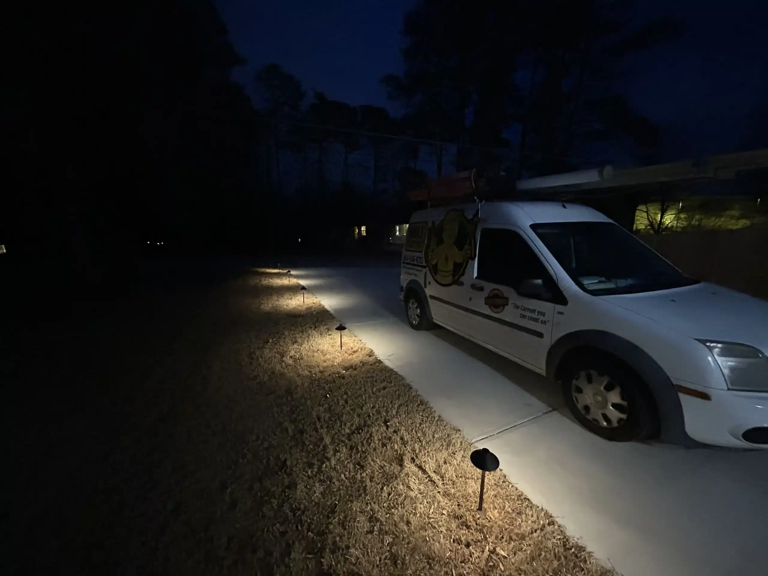 Photo of a Volt Electric work van next to some walkway lighting